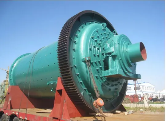 Large green ball mill with ring gear on a transport trailer