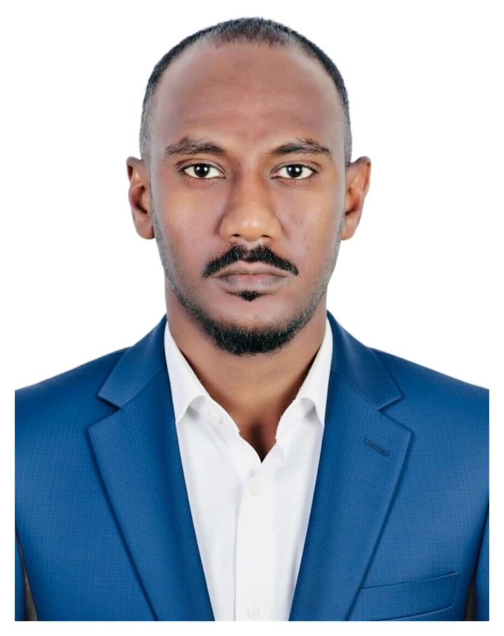 Portrait of Ibrahim AbdelMagid, founder and CEO of Humithra Trading, in a blue suit and white shirt